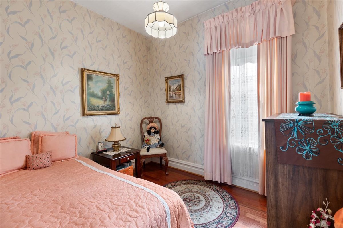 3911 North Kedzie Avenue Chicago, IL 60618 - Photo 18 of 35 a bedroom with bed and a window