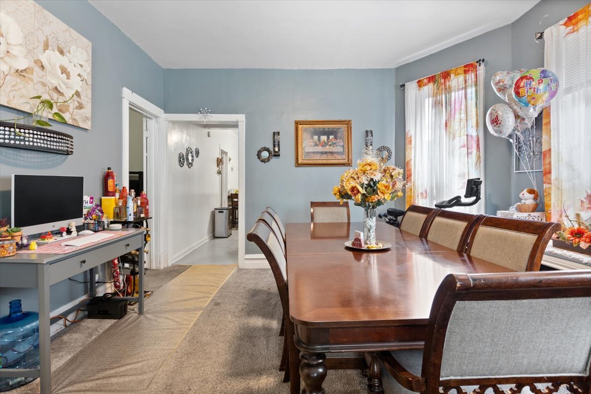 3911 North Kedzie Avenue Chicago, IL 60618 - Photo 23 of 35 a dining room with furniture and wooden floor
