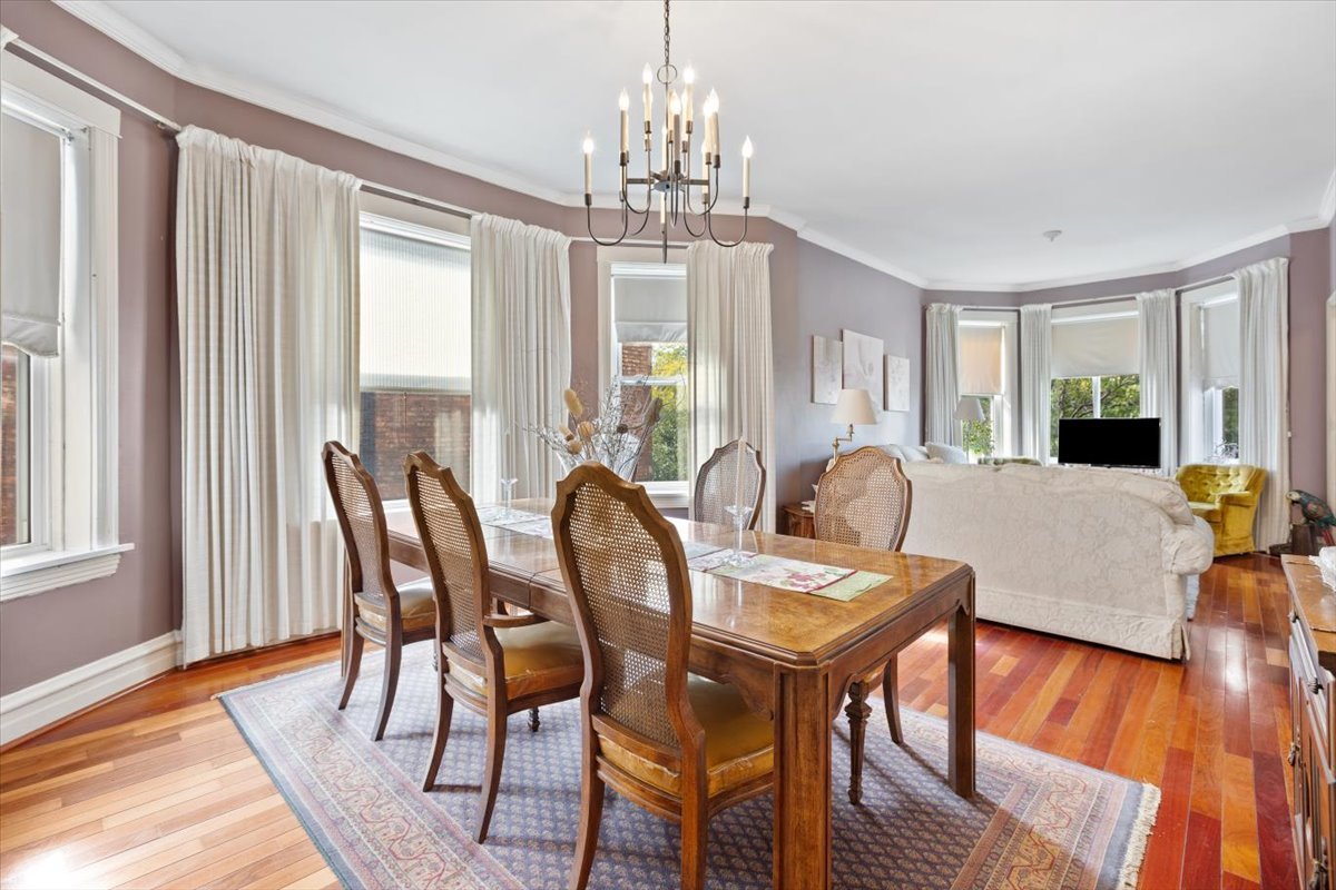 3911 North Kedzie Avenue Chicago, IL 60618 - Photo 10 of 35 a view of a dining room with furniture window and wooden floor