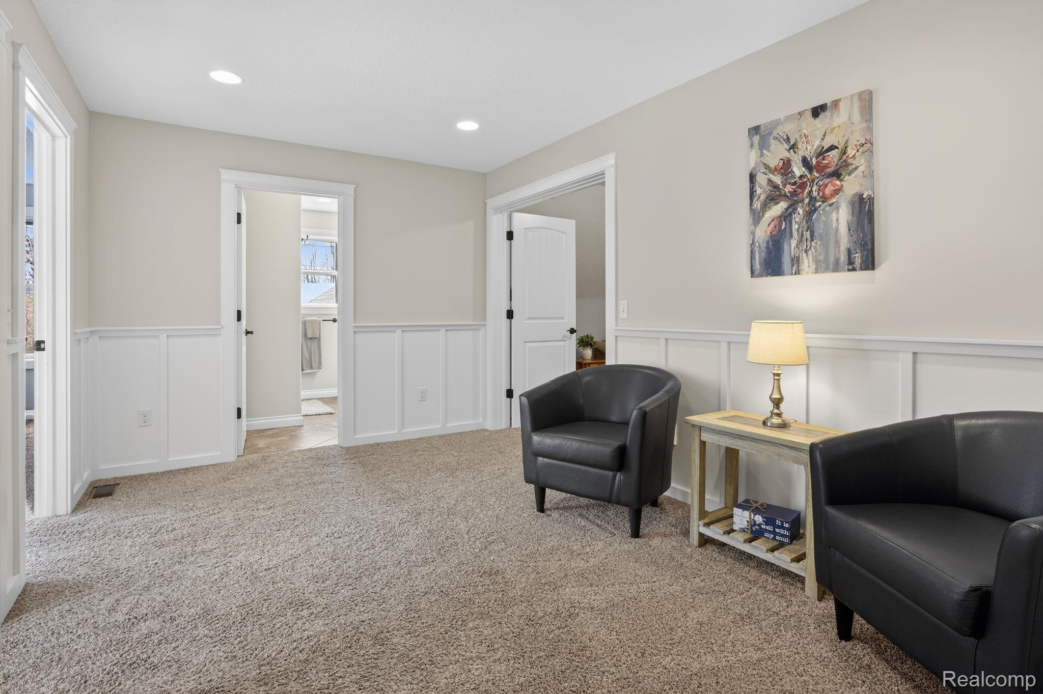 101 Highview Road Traverse City, MI 49696 - Photo 46 of 88 Living area featuring a wainscoted wall, a decorative wall, carpet floors, and recessed lighting
