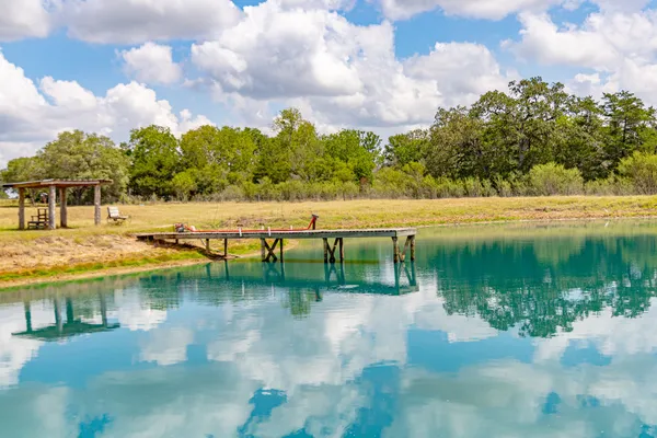 a view of a lake with a yard