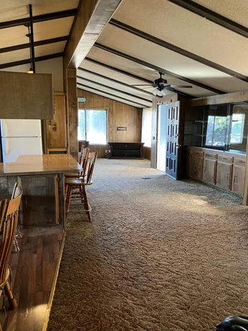 a view of a livingroom with furniture and window