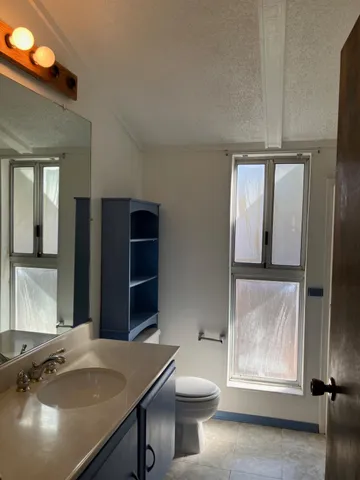 a view of a kitchen area with furniture and window