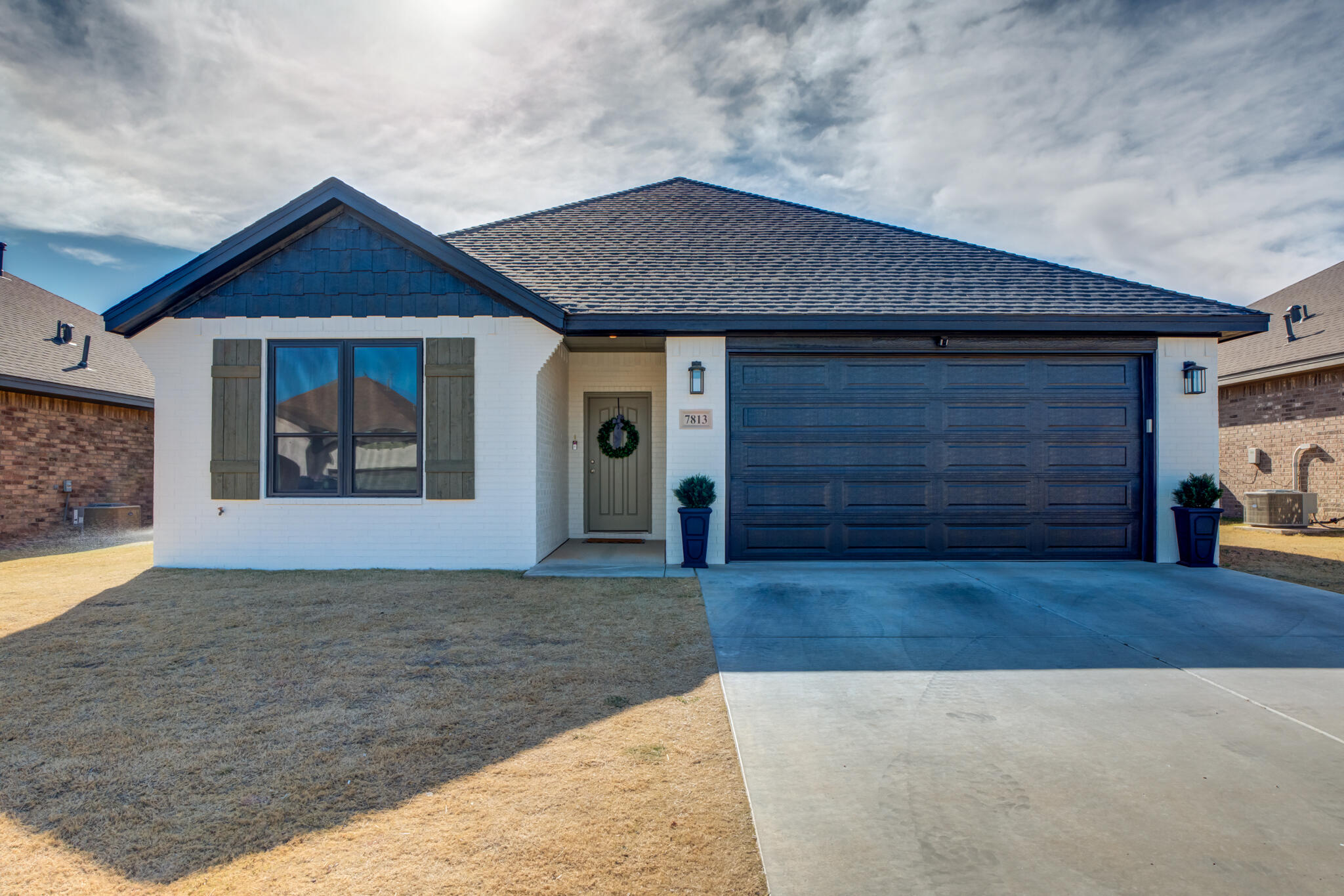 a view of a house with small yard