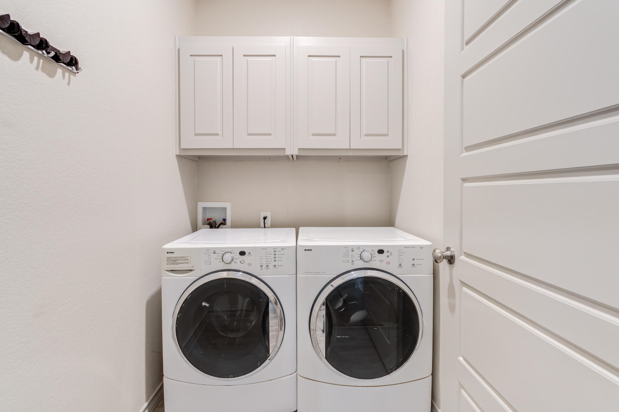 7813 88th Street Lubbock, TX 79424 - Photo 18 of 21 a utility room with dryer and washer