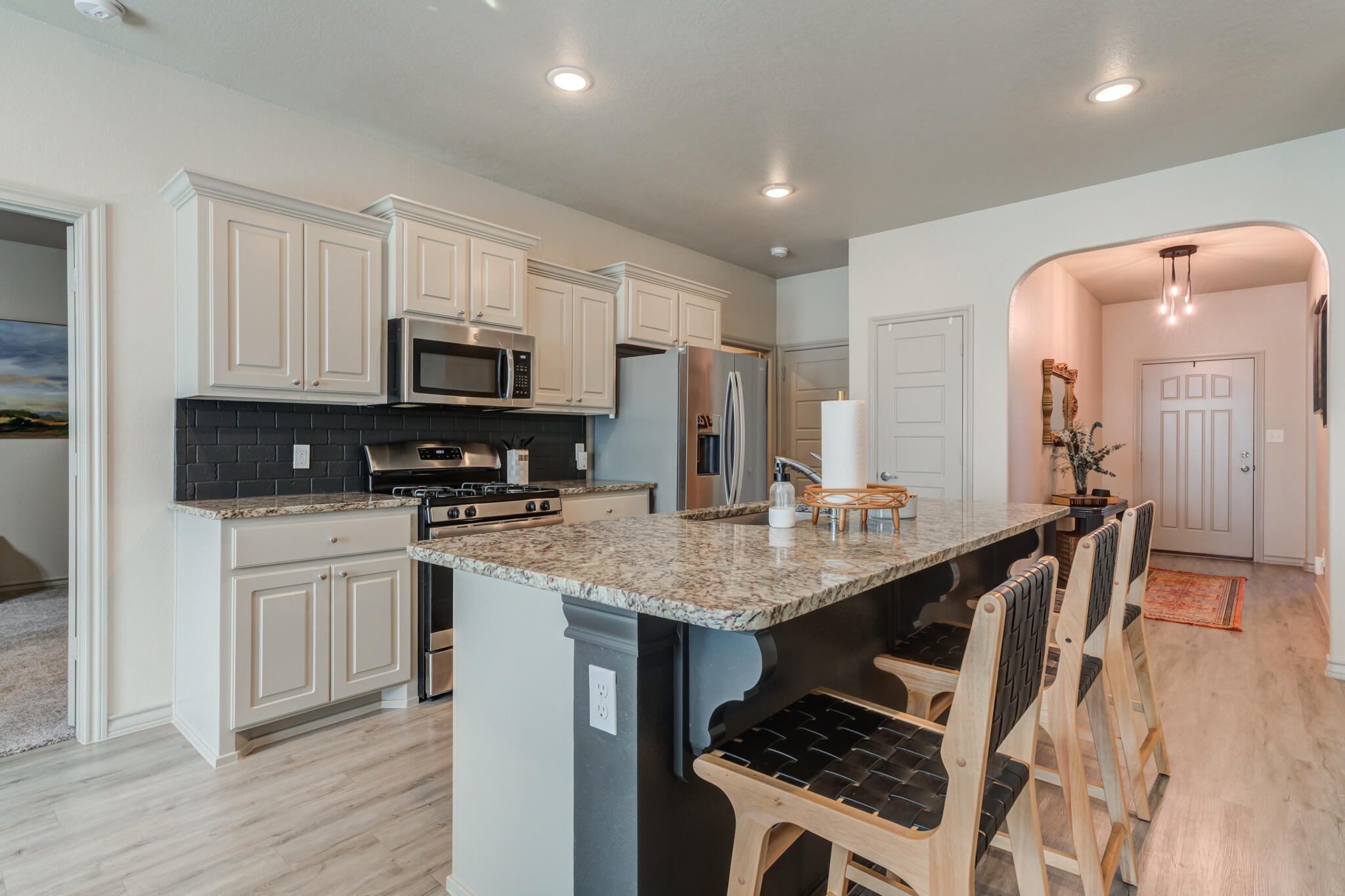 7813 88th Street Lubbock, TX 79424 - Photo 2 of 21 a kitchen with appliances a sink and cabinets