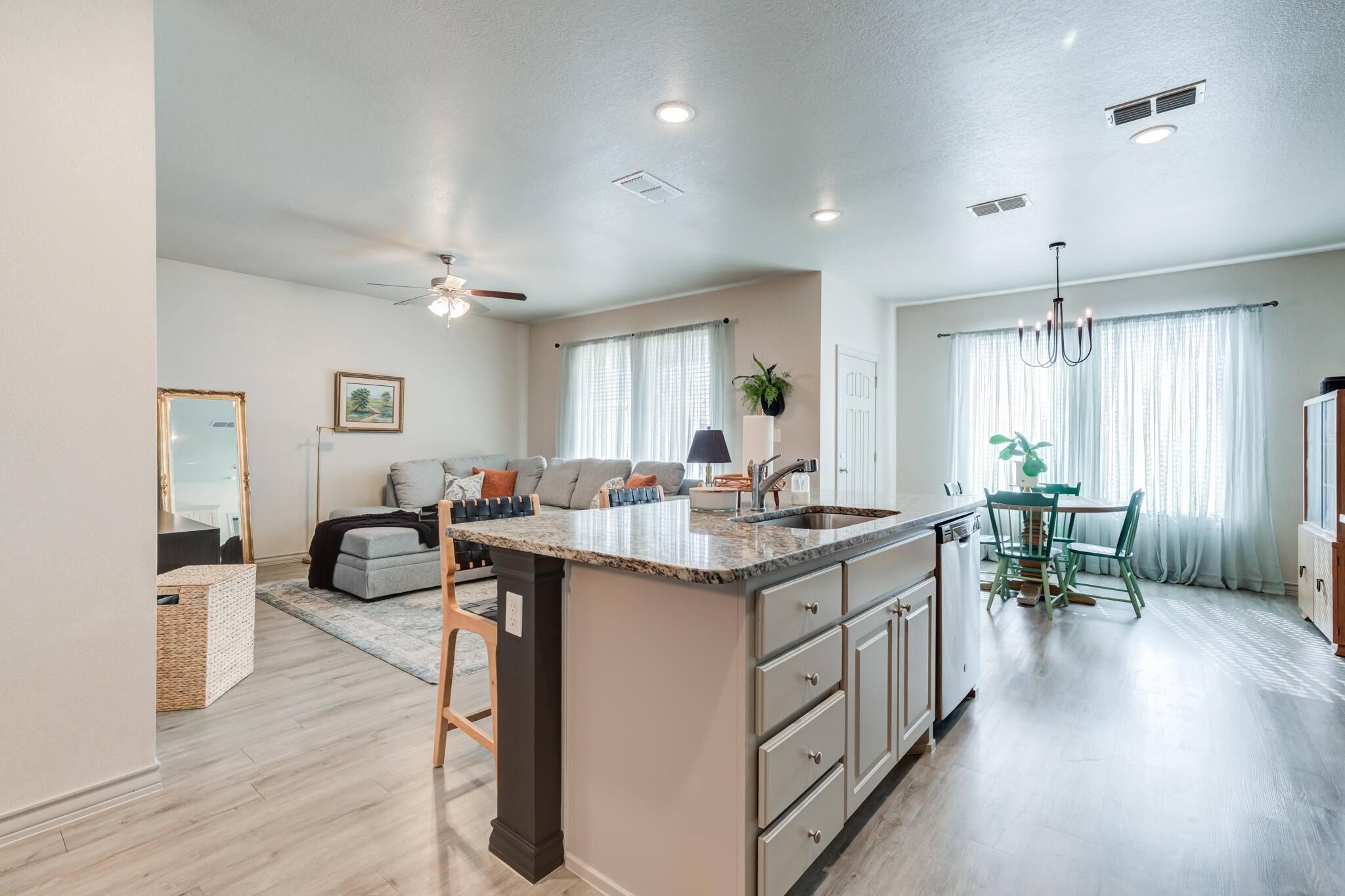7813 88th Street Lubbock, TX 79424 - Photo 6 of 21 a kitchen with counter top space and wooden floor