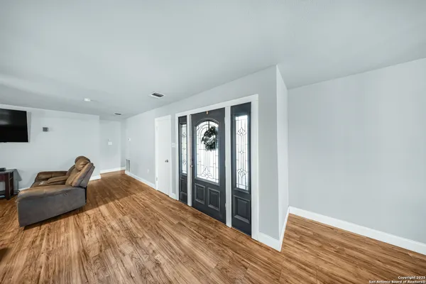 a bedroom with a bed and a mirror