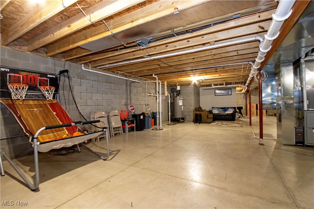 8249 Town Line Road Shiloh, OH 44878 - Photo 23 of 34 Unfinished basement with water heater