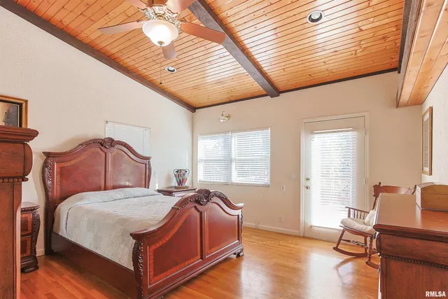 a bed room with a bed and a chair