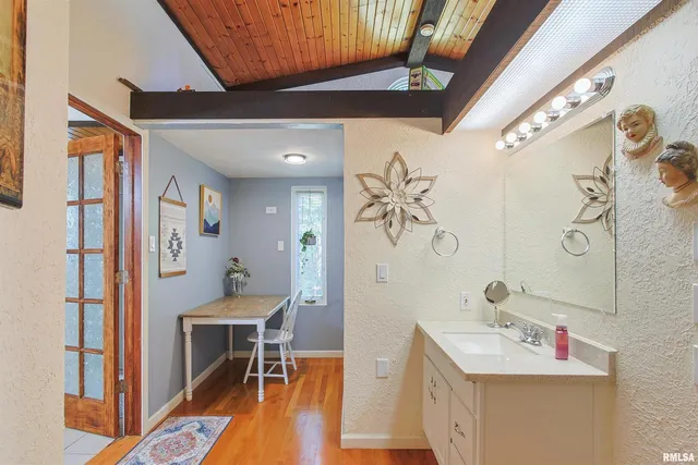 a bathroom with a sink and a mirror