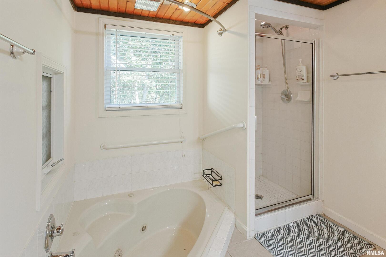 2115 North Lick Creek Road Goreville, IL 62939 - Photo 14 of 28 a bathroom with a bathtub and a shower