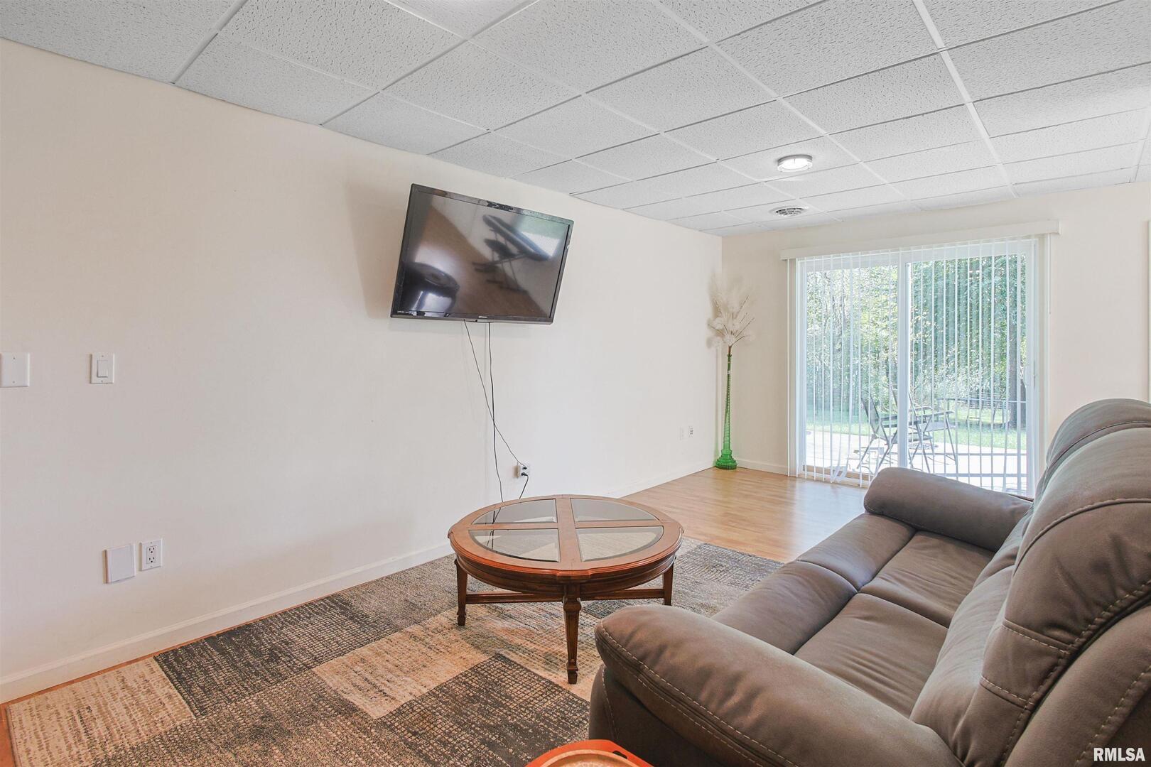 2115 North Lick Creek Road Goreville, IL 62939 - Photo 17 of 28 a living room with furniture and a wooden floor