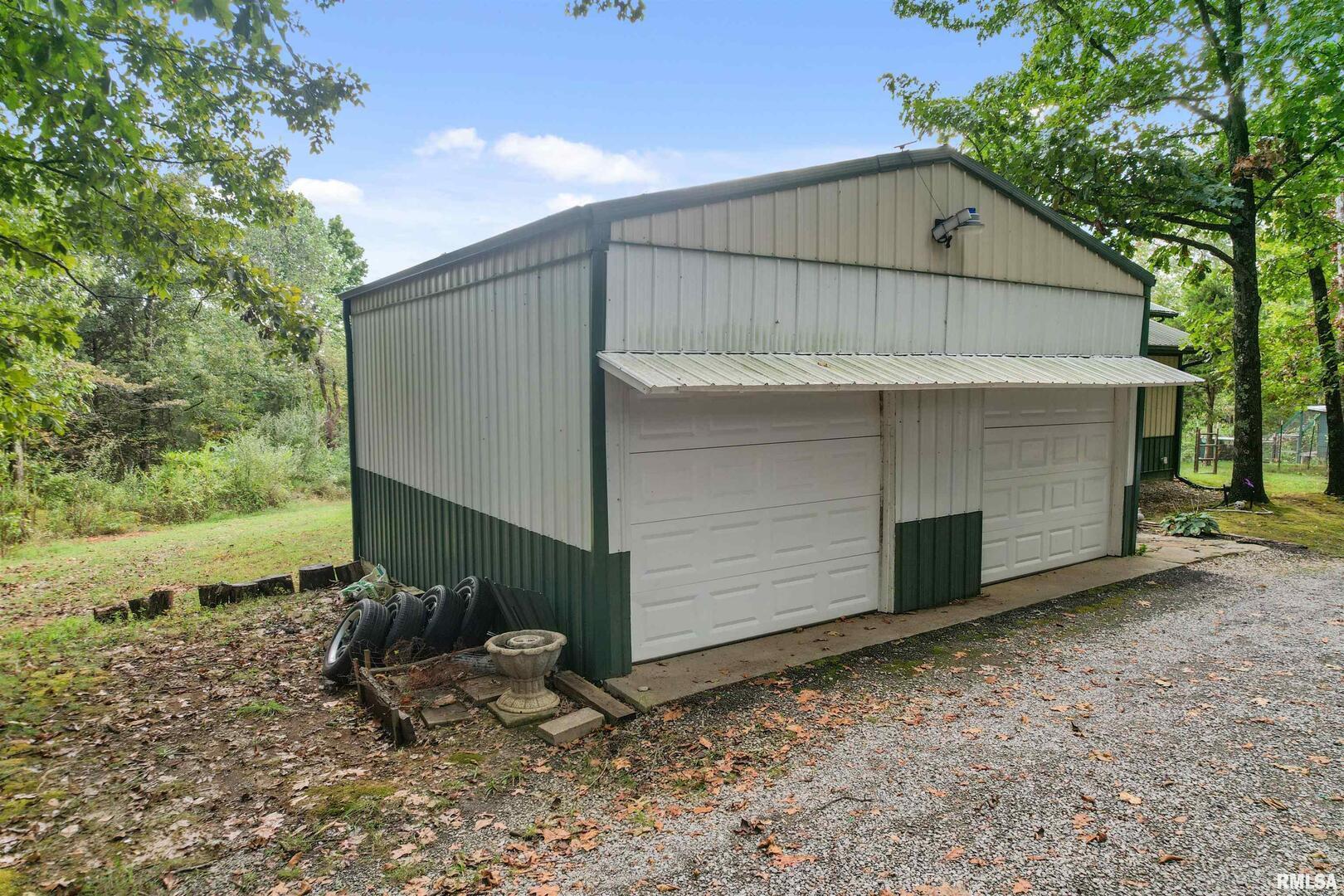 2115 North Lick Creek Road Goreville, IL 62939 - Photo 25 of 28 a view of a house with backyard