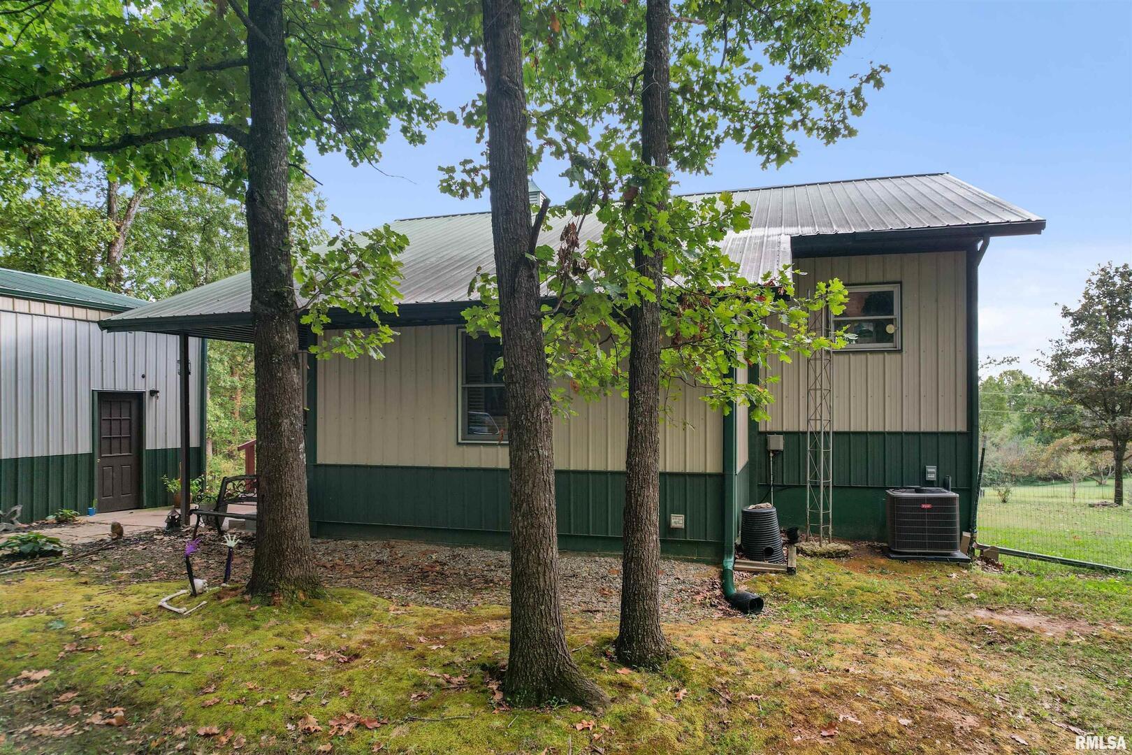 2115 North Lick Creek Road Goreville, IL 62939 - Photo 26 of 28 a front view of a house with garden