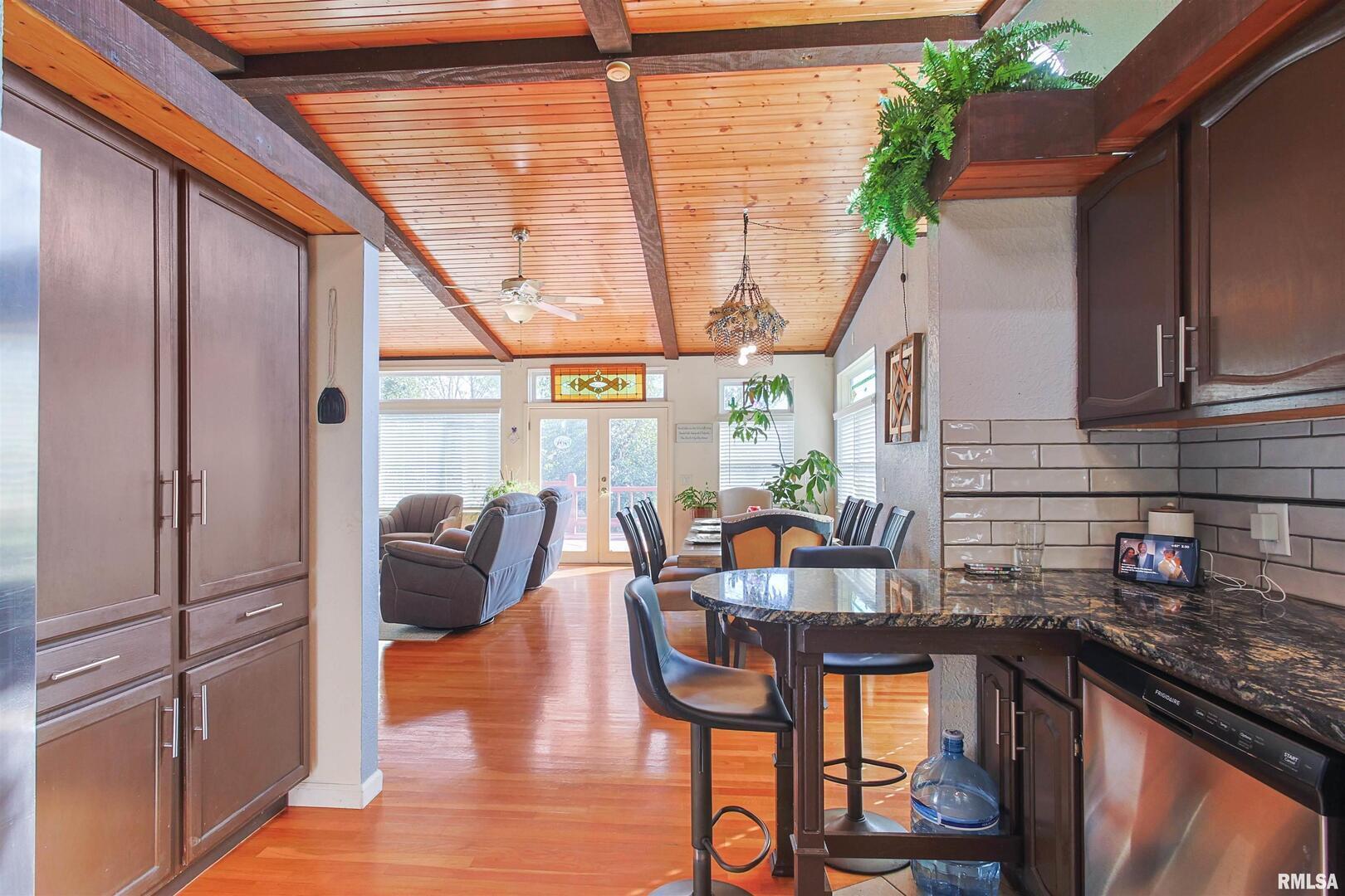 2115 North Lick Creek Road Goreville, IL 62939 - Photo 5 of 28 a open kitchen with stainless steel appliances granite countertop a refrigerator and a stove