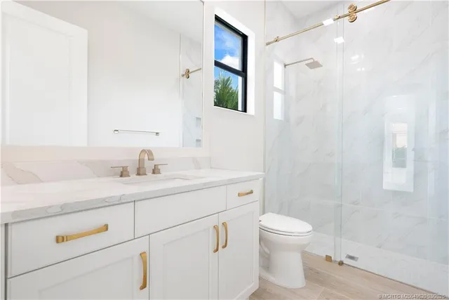 a bathroom with white cabinets