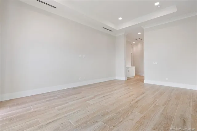 a spacious bathroom with a sink and a mirror