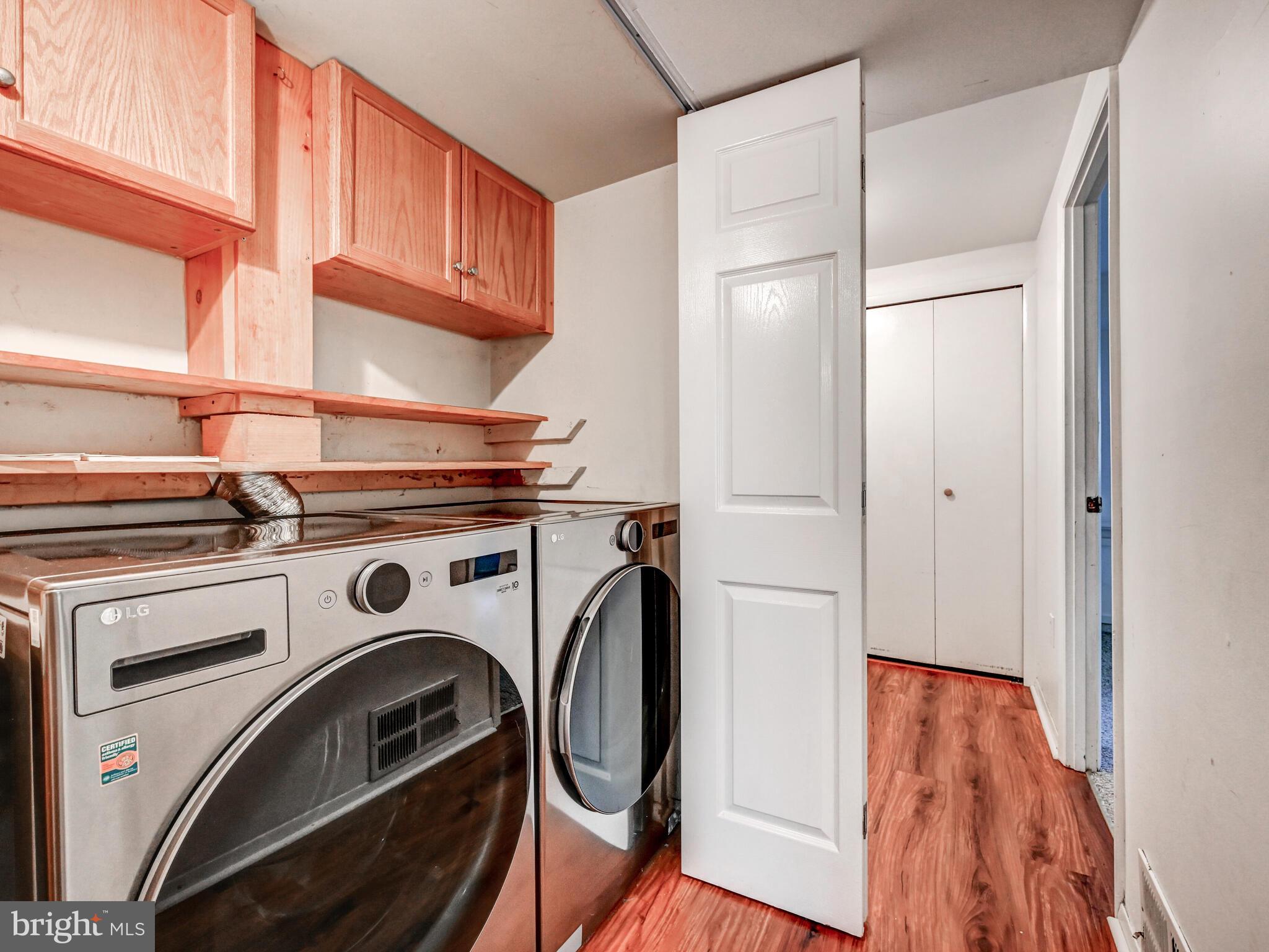 7230 Lasting Light Way Columbia, MD 21045 - Photo 19 of 27 LAUNDRY CLOSET WITH UPGRADED FRONT LOADING W/D