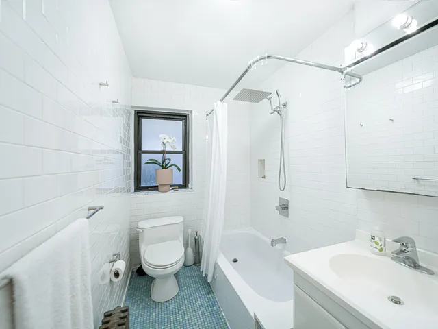 a kitchen with a stove and a white cabinet