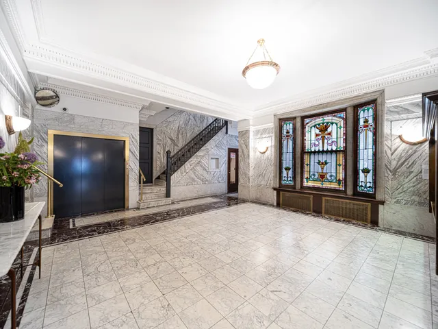a bathroom with a toilet sink and shower
