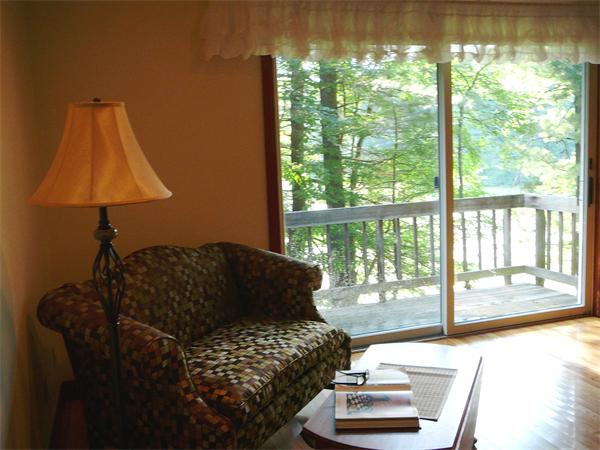 499 Dutton Road Sudbury, MA 01776 - Photo 11 of 21 a living room with furniture and a large window