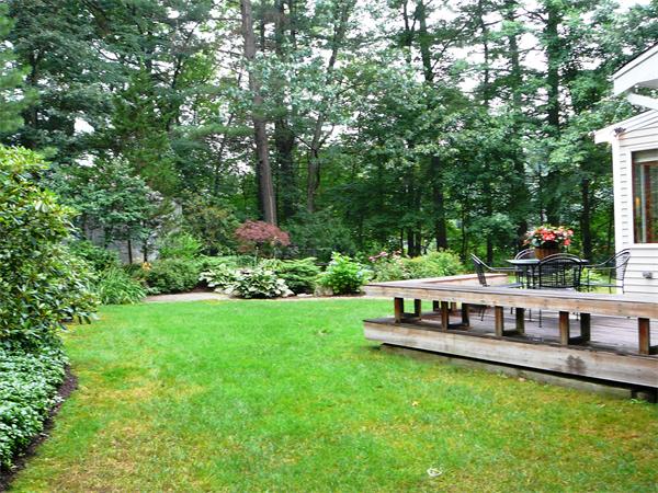 499 Dutton Road Sudbury, MA 01776 - Photo 20 of 21 a view of a house with backyard and sitting area