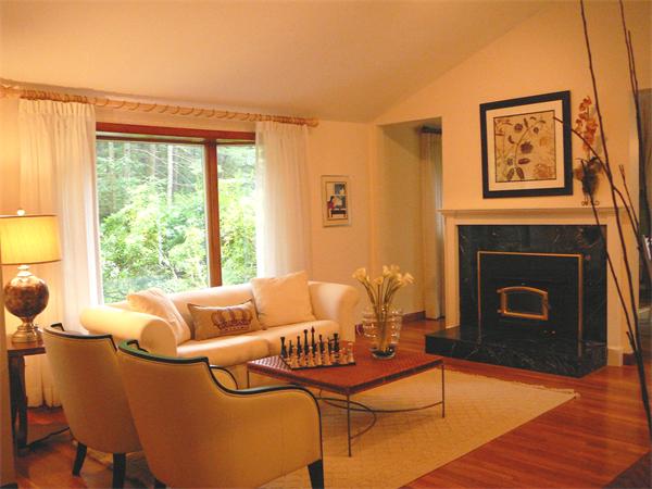 499 Dutton Road Sudbury, MA 01776 - Photo 3 of 21 a living room with furniture and a fireplace
