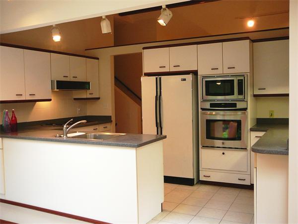 499 Dutton Road Sudbury, MA 01776 - Photo 7 of 21 a kitchen with stainless steel appliances a refrigerator sink and microwave