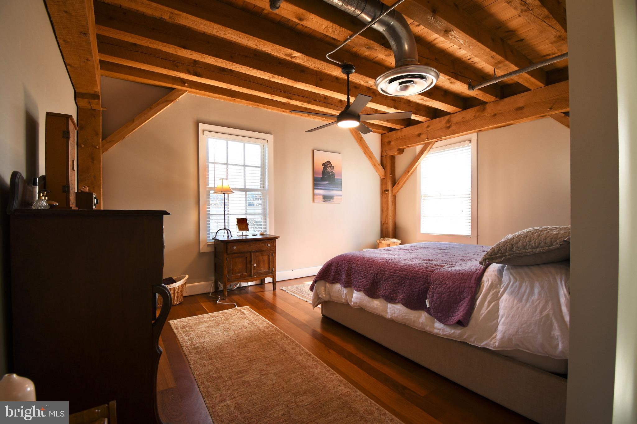 26 East Lancaster Avenue, Unit R3 Downingtown, PA 19335 - Photo 11 of 25 a bedroom with a bed and wooden floor