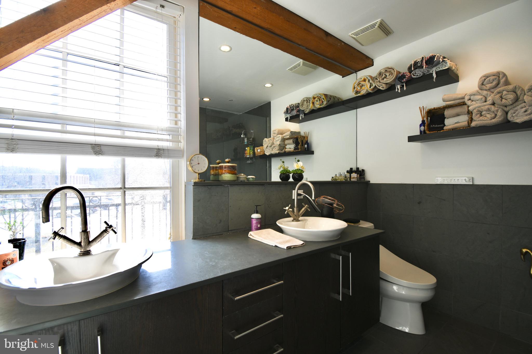 26 East Lancaster Avenue, Unit R3 Downingtown, PA 19335 - Photo 13 of 25 a bathroom with a sink and a toilet