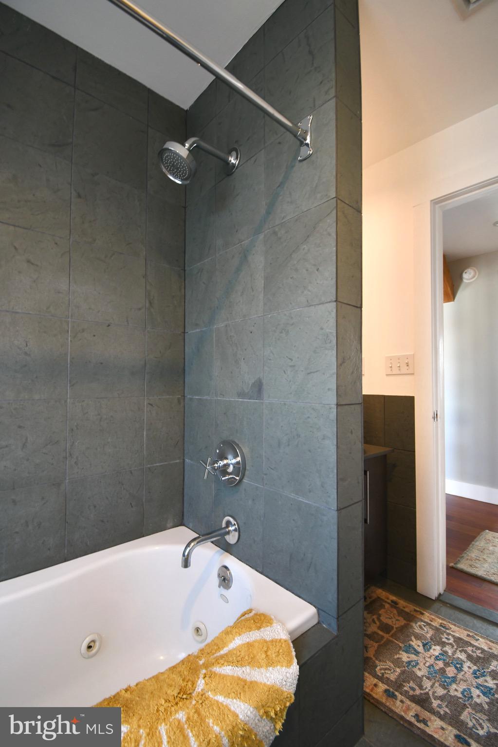 26 East Lancaster Avenue, Unit R3 Downingtown, PA 19335 - Photo 21 of 25 a bathroom with a tub and shower