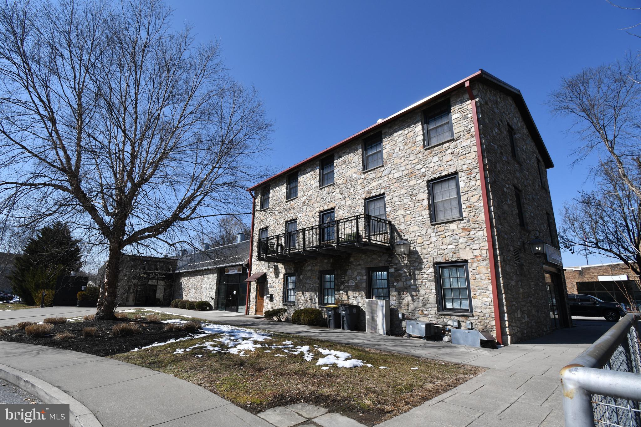 26 East Lancaster Avenue, Unit R3 Downingtown, PA 19335 - Photo 25 of 25 a front view of a building with street view