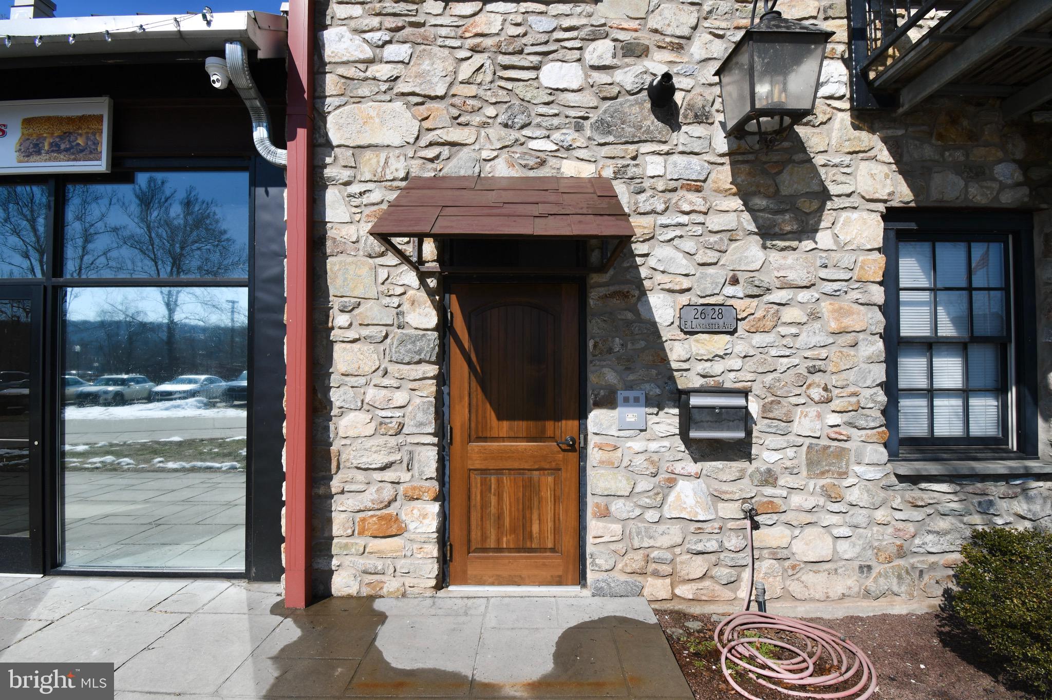26 East Lancaster Avenue, Unit R3 Downingtown, PA 19335 - Photo 3 of 25 a brick building with a door and a door