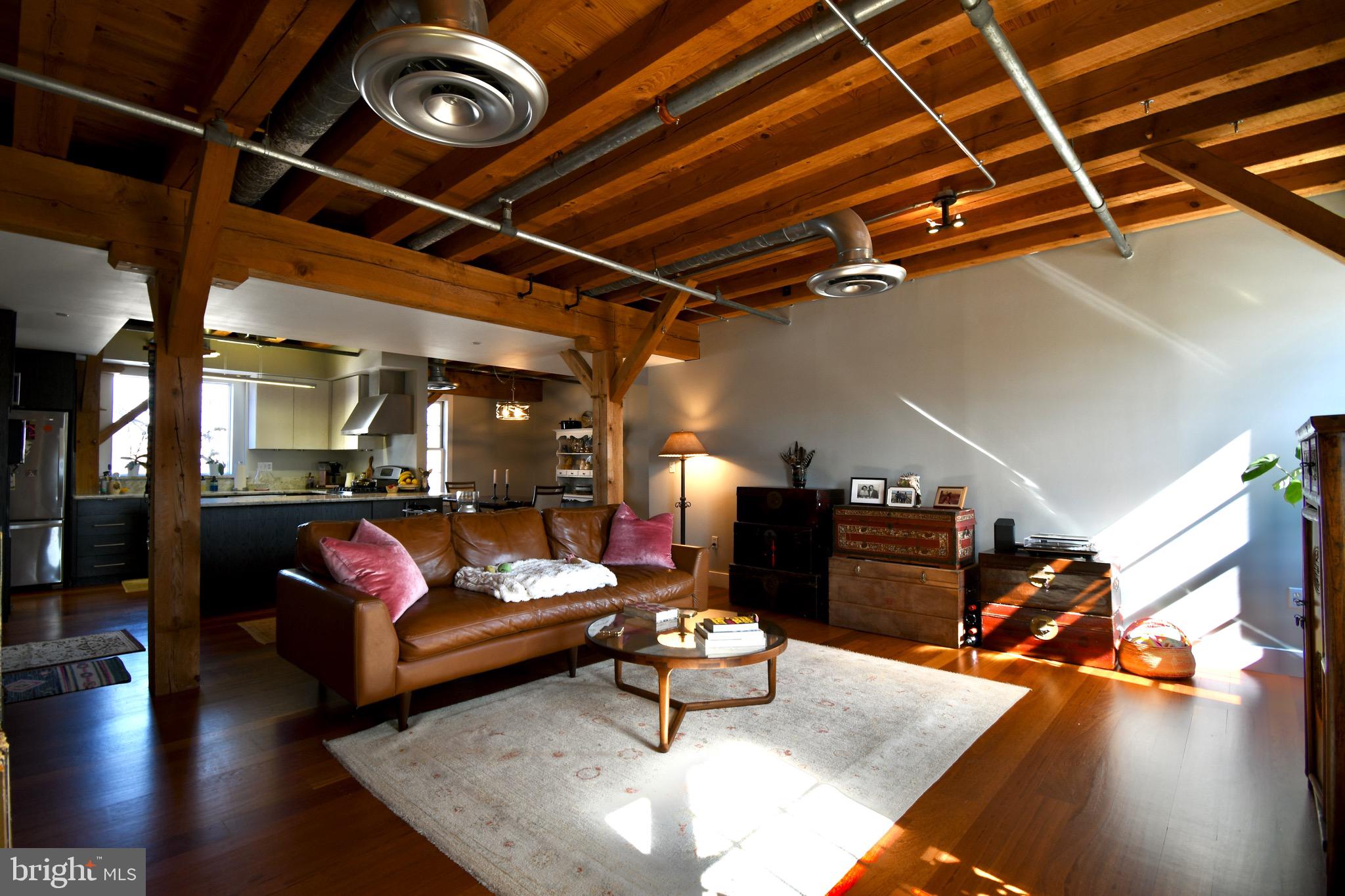 26 East Lancaster Avenue, Unit R3 Downingtown, PA 19335 - Photo 5 of 25 a living room with furniture and wooden floor