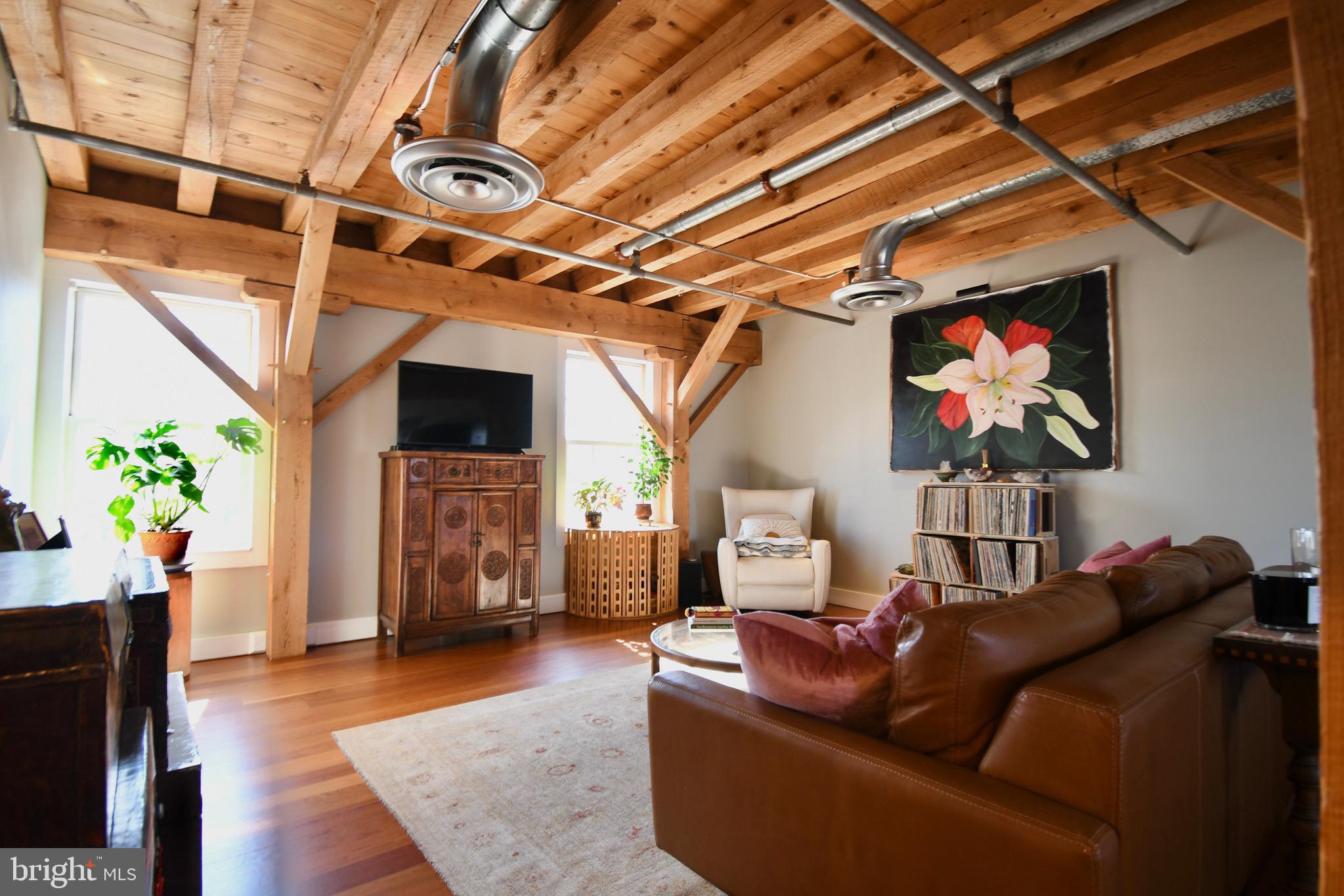 26 East Lancaster Avenue, Unit R3 Downingtown, PA 19335 - Photo 6 of 25 a living room with furniture and a flat screen tv