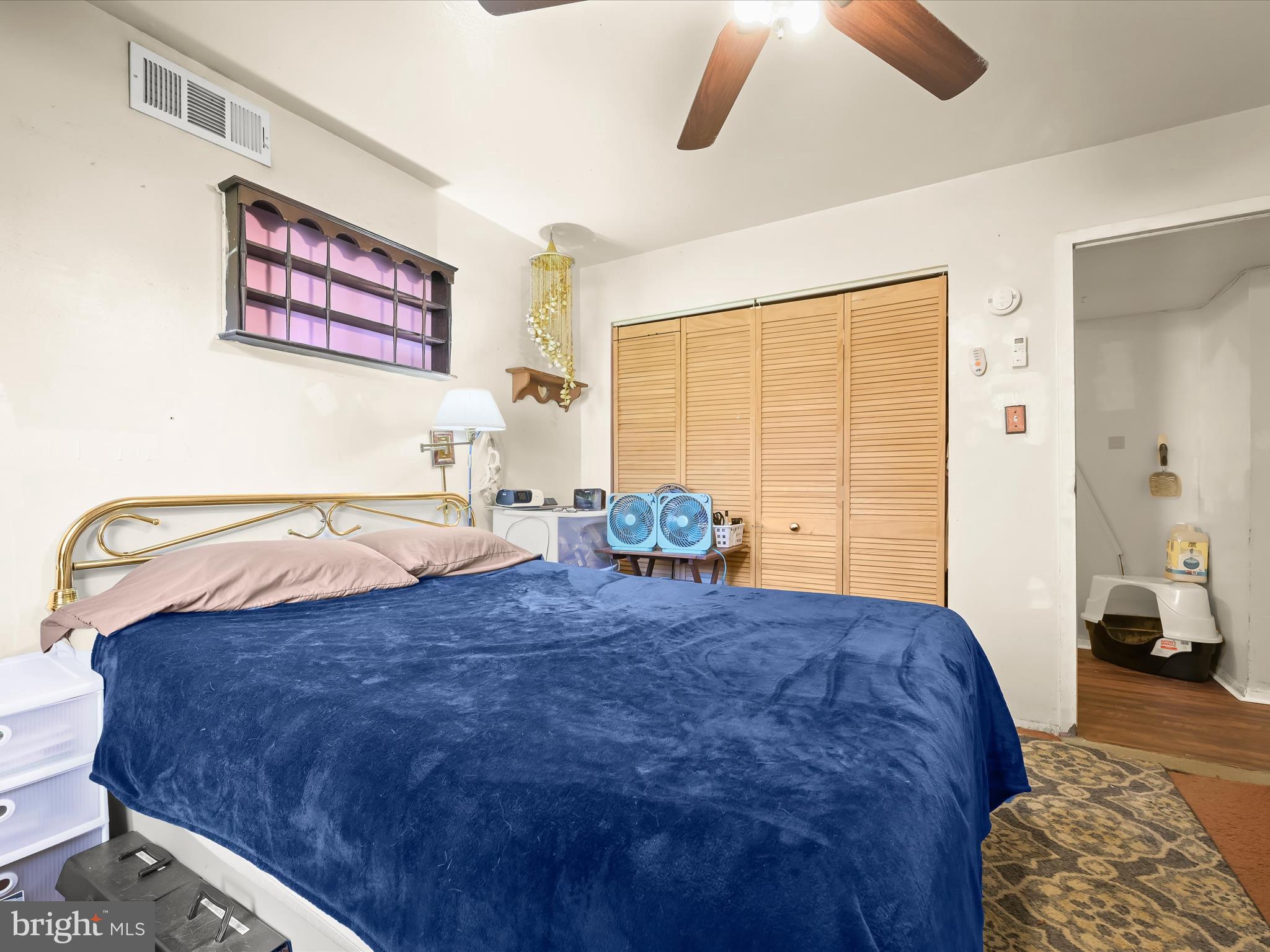 7973 Riggs Road, Unit 2 Hyattsville, MD 20783 - Photo 12 of 21 a bed sitting in a bedroom next to a window