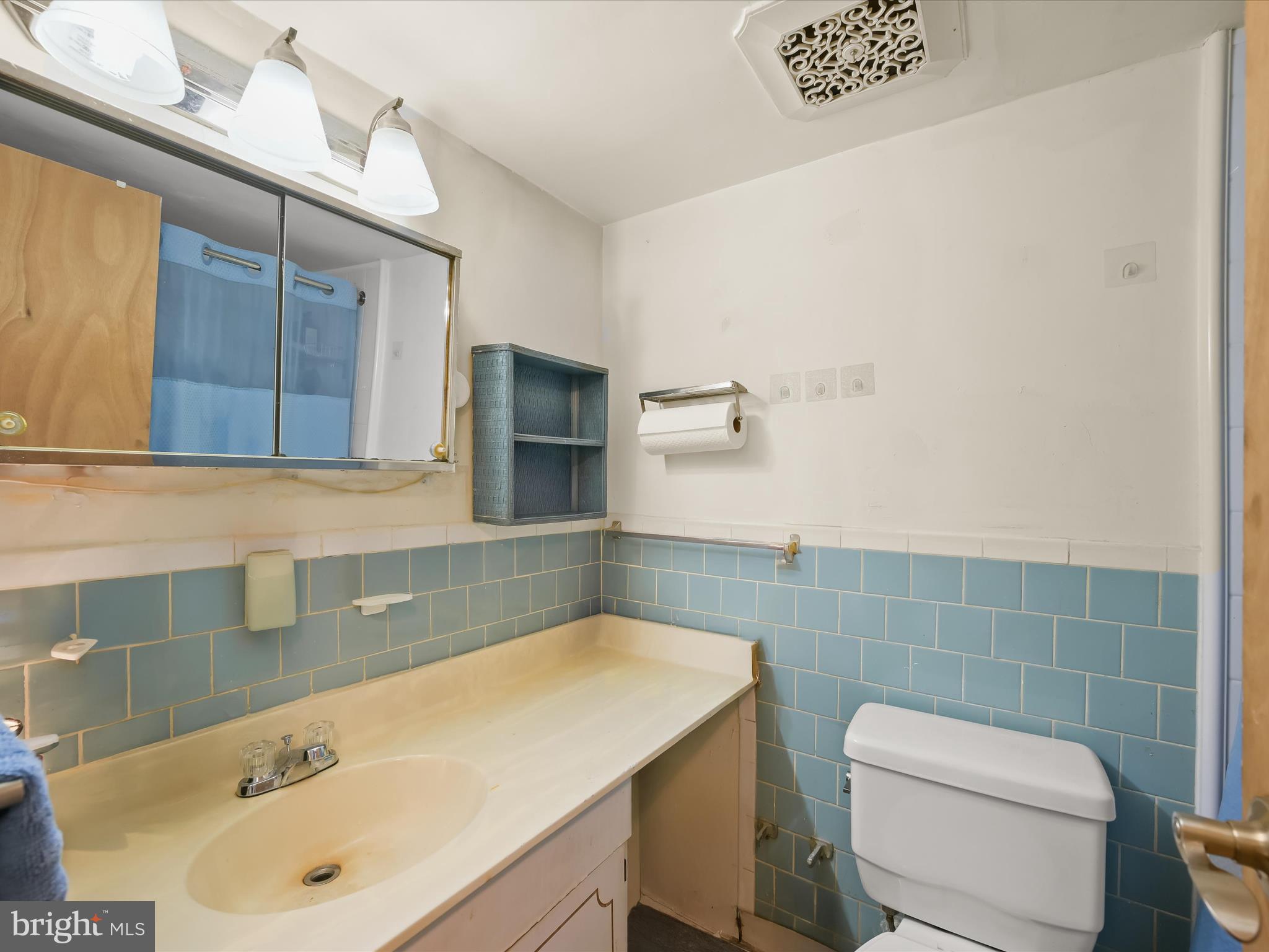 7973 Riggs Road, Unit 2 Hyattsville, MD 20783 - Photo 15 of 21 a bathroom with a sink a toilet and mirror