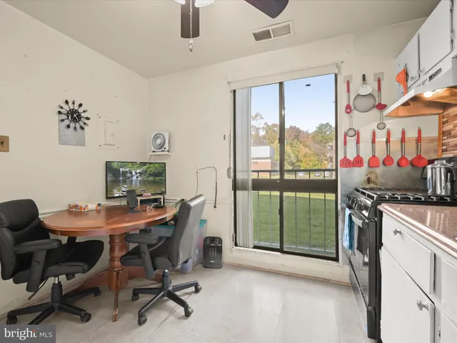a workspace with furniture and a gate