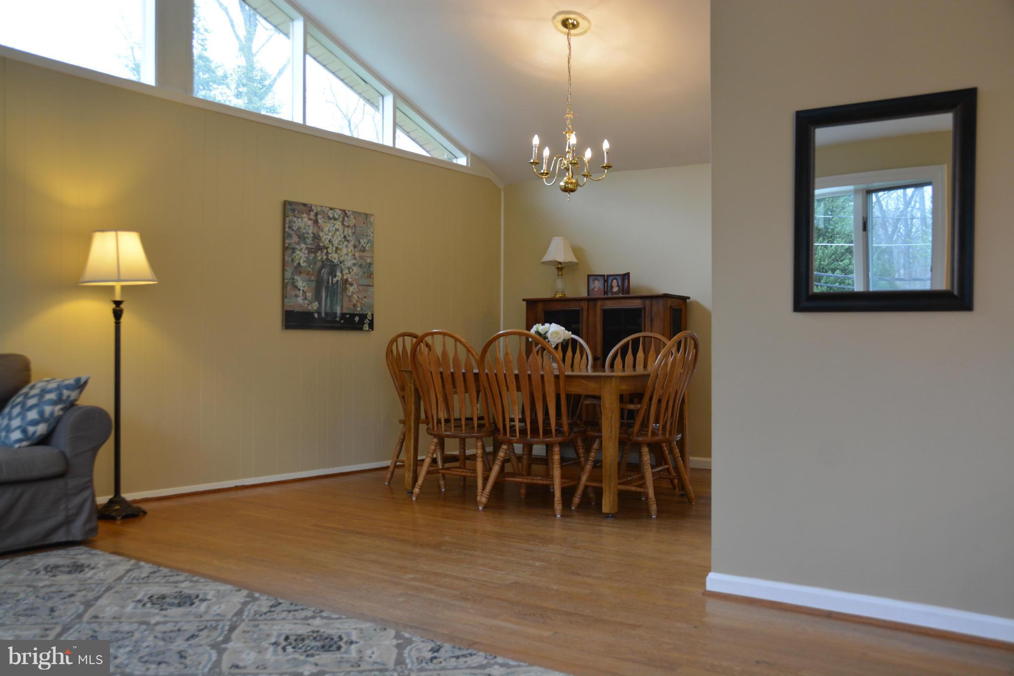 8942 Victoria Road Springfield, VA 22151 - Photo 25 of 25 a view of a dining room with furniture and chandelier