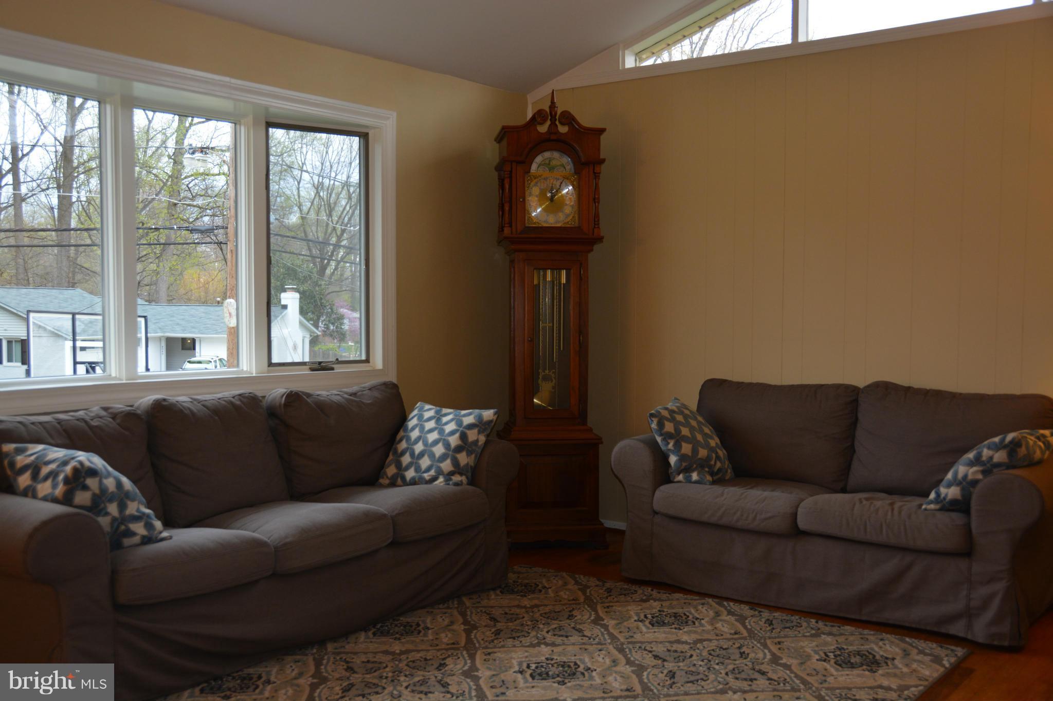 8942 Victoria Road Springfield, VA 22151 - Photo 11 of 25 a living room with furniture and a window