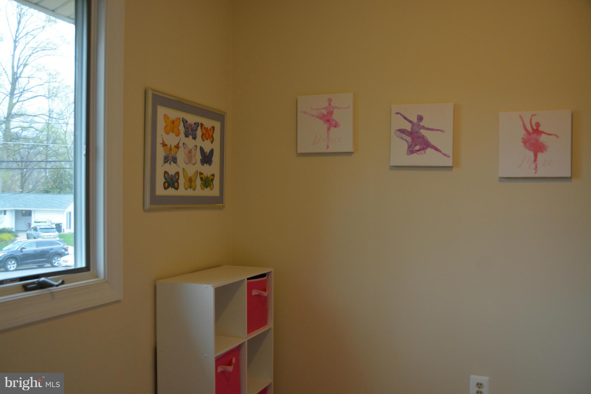 8942 Victoria Road Springfield, VA 22151 - Photo 14 of 25 a room with wall painting and a window