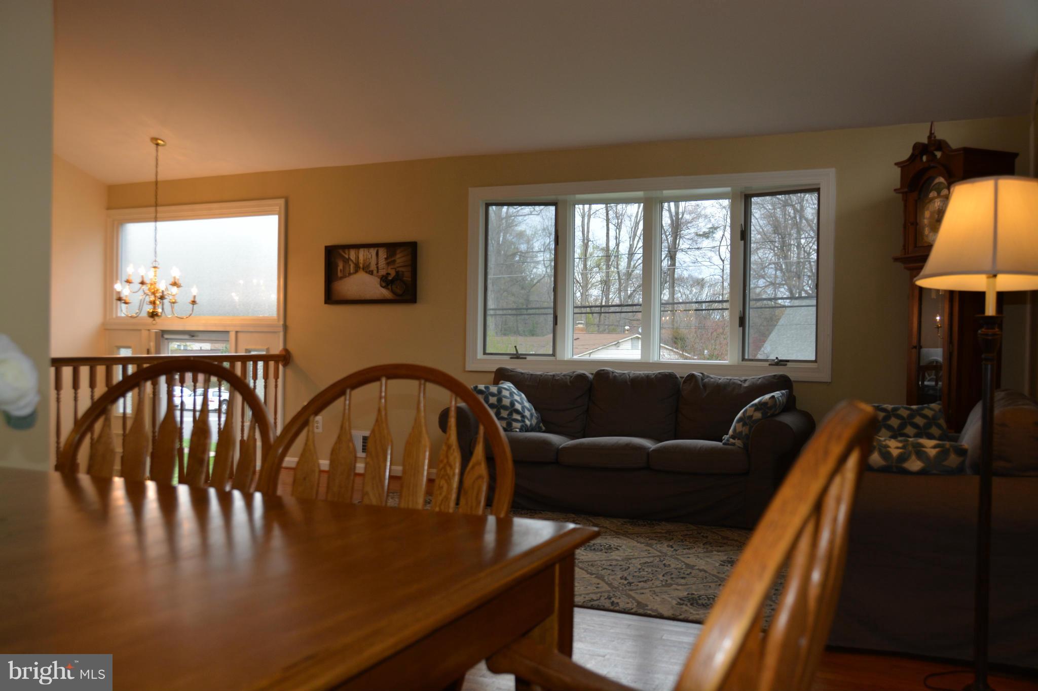 8942 Victoria Road Springfield, VA 22151 - Photo 3 of 25 a living room with furniture and a window