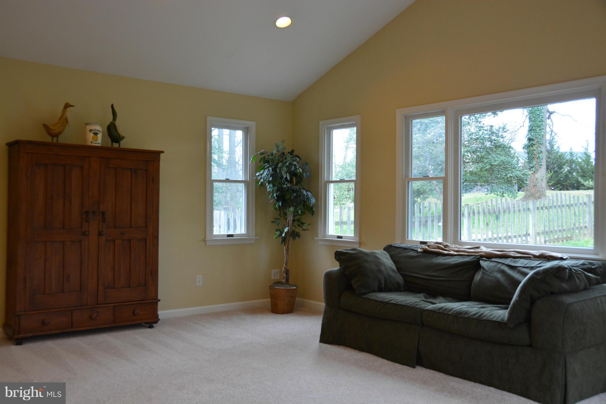 8942 Victoria Road Springfield, VA 22151 - Photo 5 of 25 a living room with furniture and a window