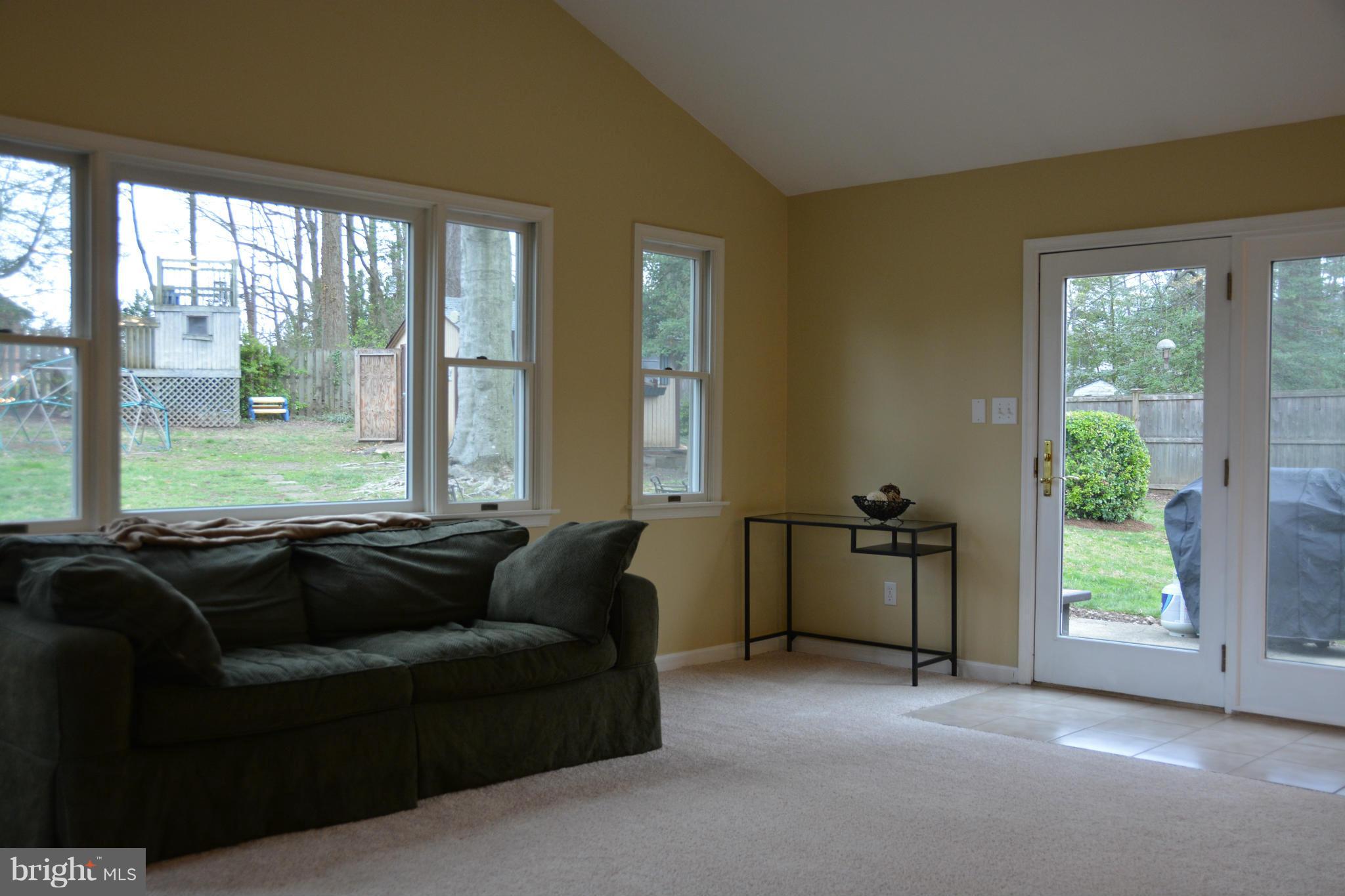 8942 Victoria Road Springfield, VA 22151 - Photo 6 of 25 a living room with furniture and windows