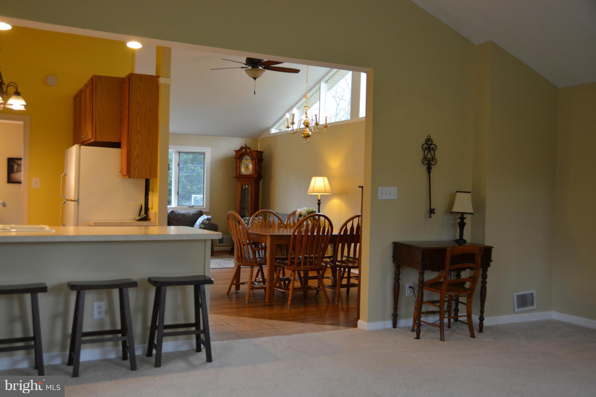 8942 Victoria Road Springfield, VA 22151 - Photo 8 of 25 a view of a a dining room with furniture and chandelier
