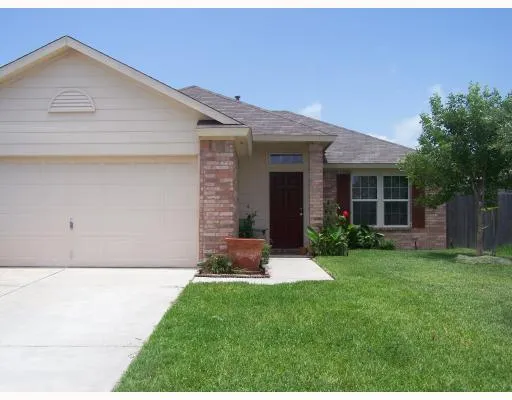 a front view of a house with a yard and porch