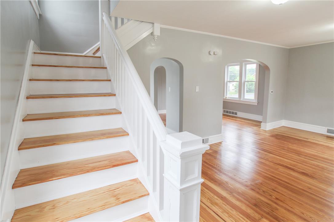 933 Philadelphia Road Easton, PA 18042 - Photo 11 of 23 Polished hardwood floors and classic arched doorways define this welcoming interior entryway.