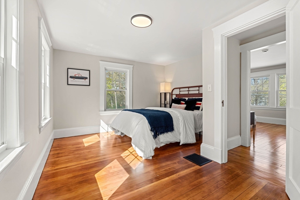 15 Middle Road Amesbury, MA 01913 - Photo 11 of 16 a bedroom with a bed and wooden floor