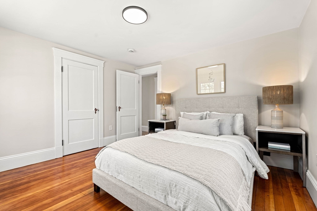 15 Middle Road Amesbury, MA 01913 - Photo 13 of 16 a bedroom with a bed and wooden floor